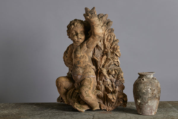 Mid to Late 18th Century Terra Cotta Fountainhead of a Putto Riding a Dolphin