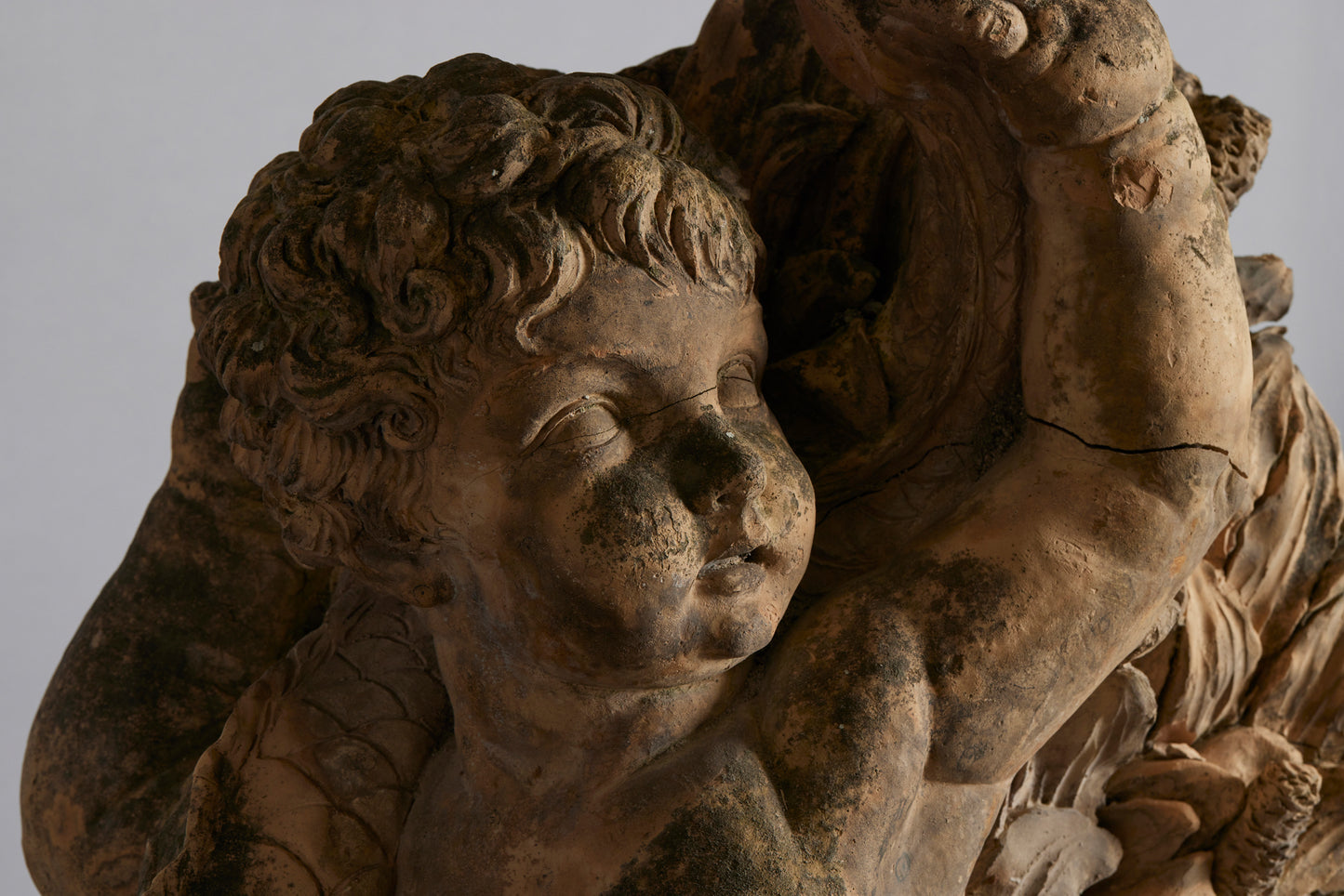 Mid to Late 18th Century Terra Cotta Fountainhead of a Putto Riding a Dolphin