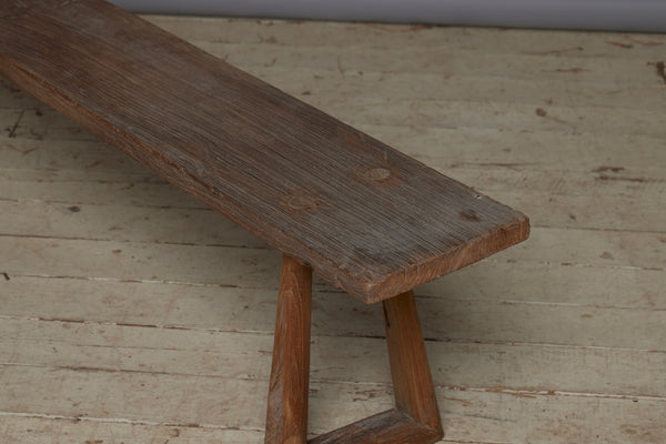 A Wide Top Splayed Leg Early Teak Bench with Beautiful Butterfly Repairs to the Top and a Round Tapered Leg