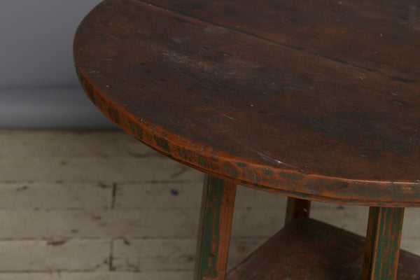 Late 19th Century Arts and Crafts Style Round Top Primitive Teak End Table with a Small Display Shelve Underneath with Traces of Old Green Paint