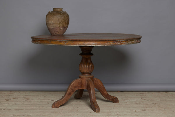 19th Century Two Board Round Top Teak Pedestal Table with a Gadroon Base and Traces of Old Paint