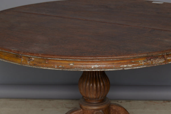 19th Century Two Board Round Top Teak Pedestal Table with a Gadroon Base and Traces of Old Paint