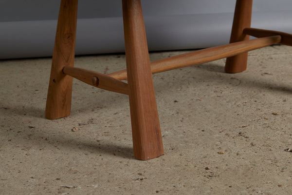 Primitive Oval Top Burled Teak Coffee Table with a Turned Stretcher Base