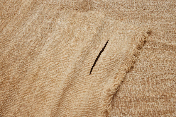 Medium All Cream Natural Hemp Carpet with a Central Floating Symbol in Brown Goat Hair ................... (5' 8" x 11' 4")