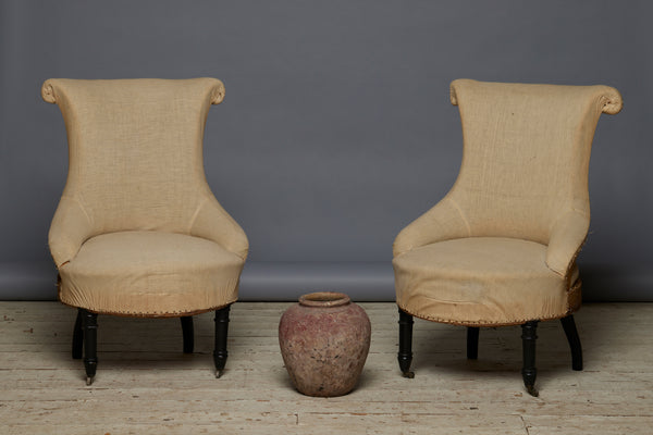 Pair of French Scrolled Back Upholstered Chairs with Turned Ebonized Legs on Casters