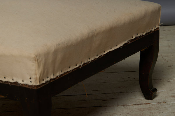 Shaped French Upholstered Ottoman with Cabriolet Legs