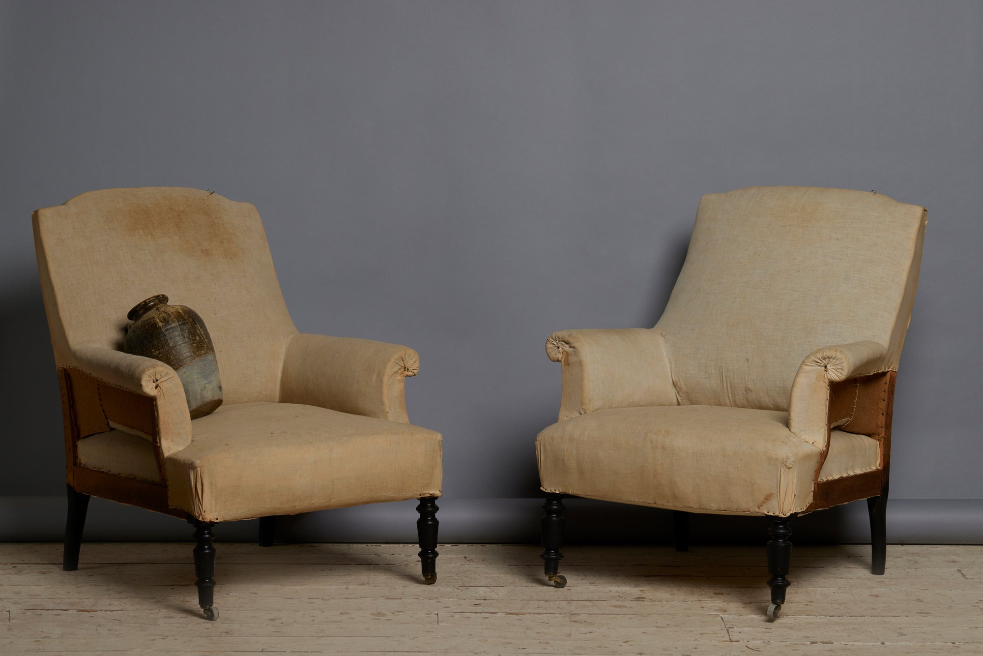 Pair of Late 19th Century French Upholstered Armchairs with Crested Backs