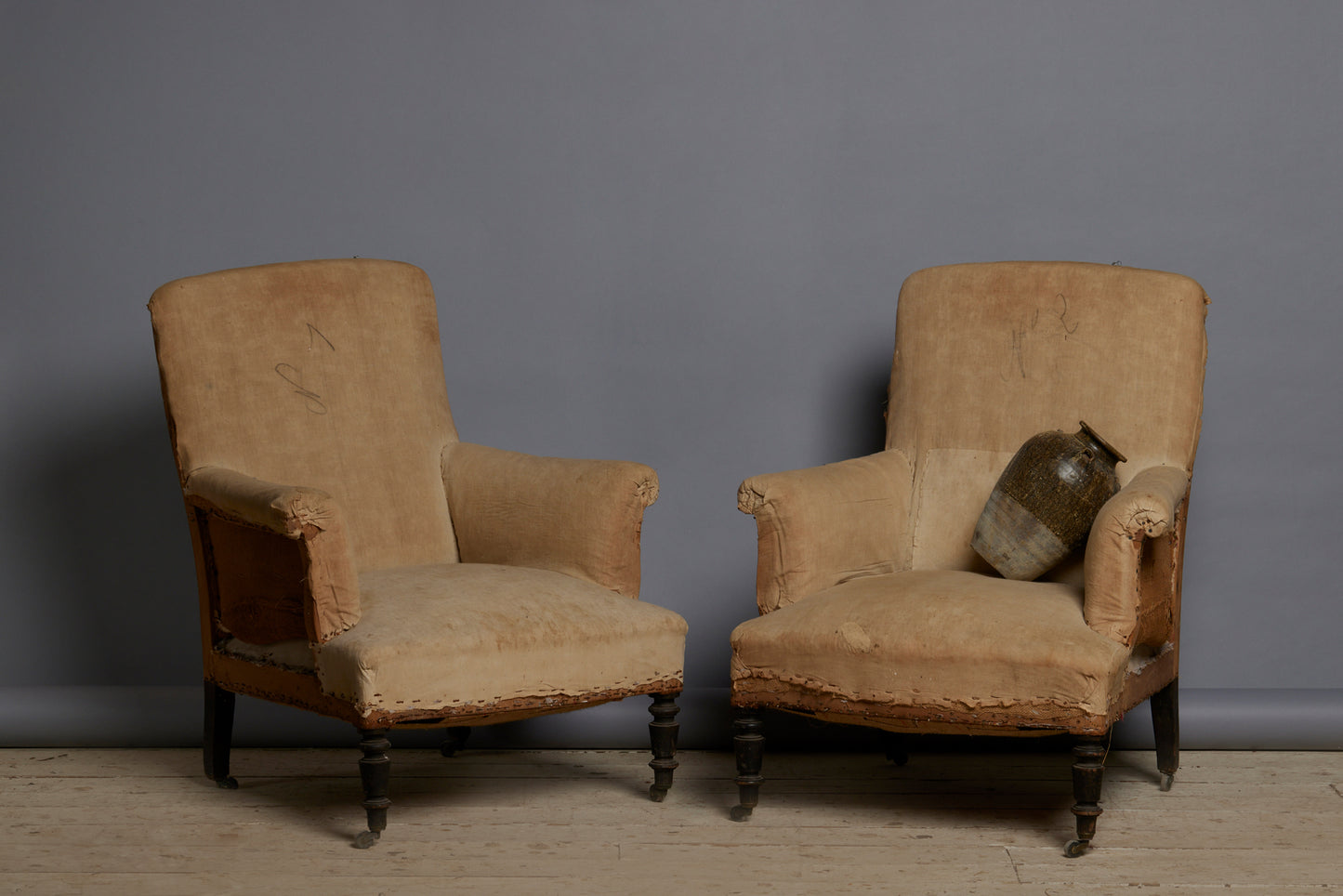 Pair of Edwardian Upholstered Armchairs with Slightly Flared Arms & Rounded Shoulders