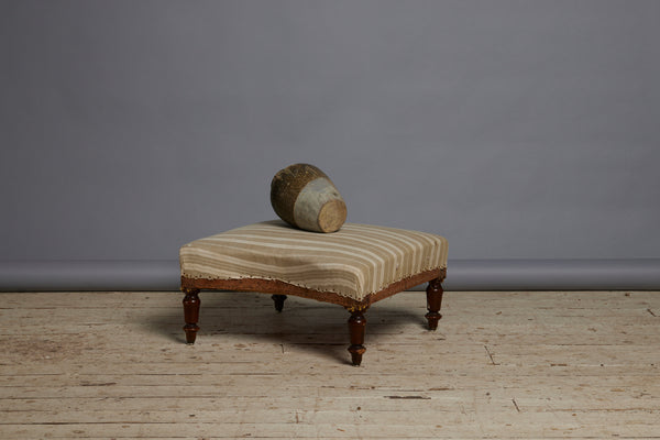 Shaped French Upholstered Ottoman with Simple Turned Legs