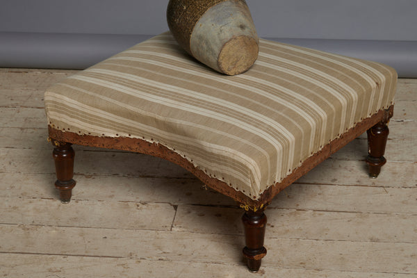 Shaped French Upholstered Ottoman with Simple Turned Legs