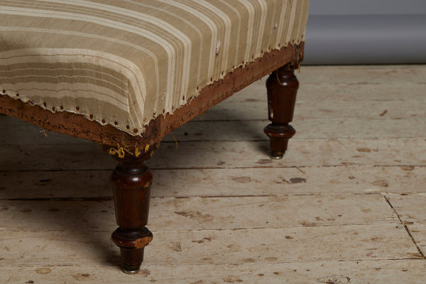 Shaped French Upholstered Ottoman with Simple Turned Legs