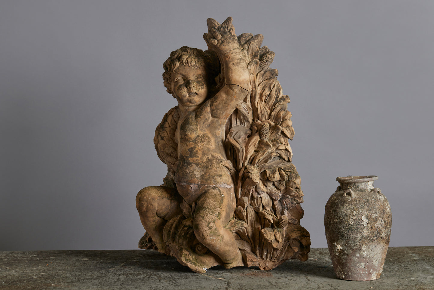Mid to Late 18th Century Terra Cotta Fountainhead of a Putto Riding a Dolphin