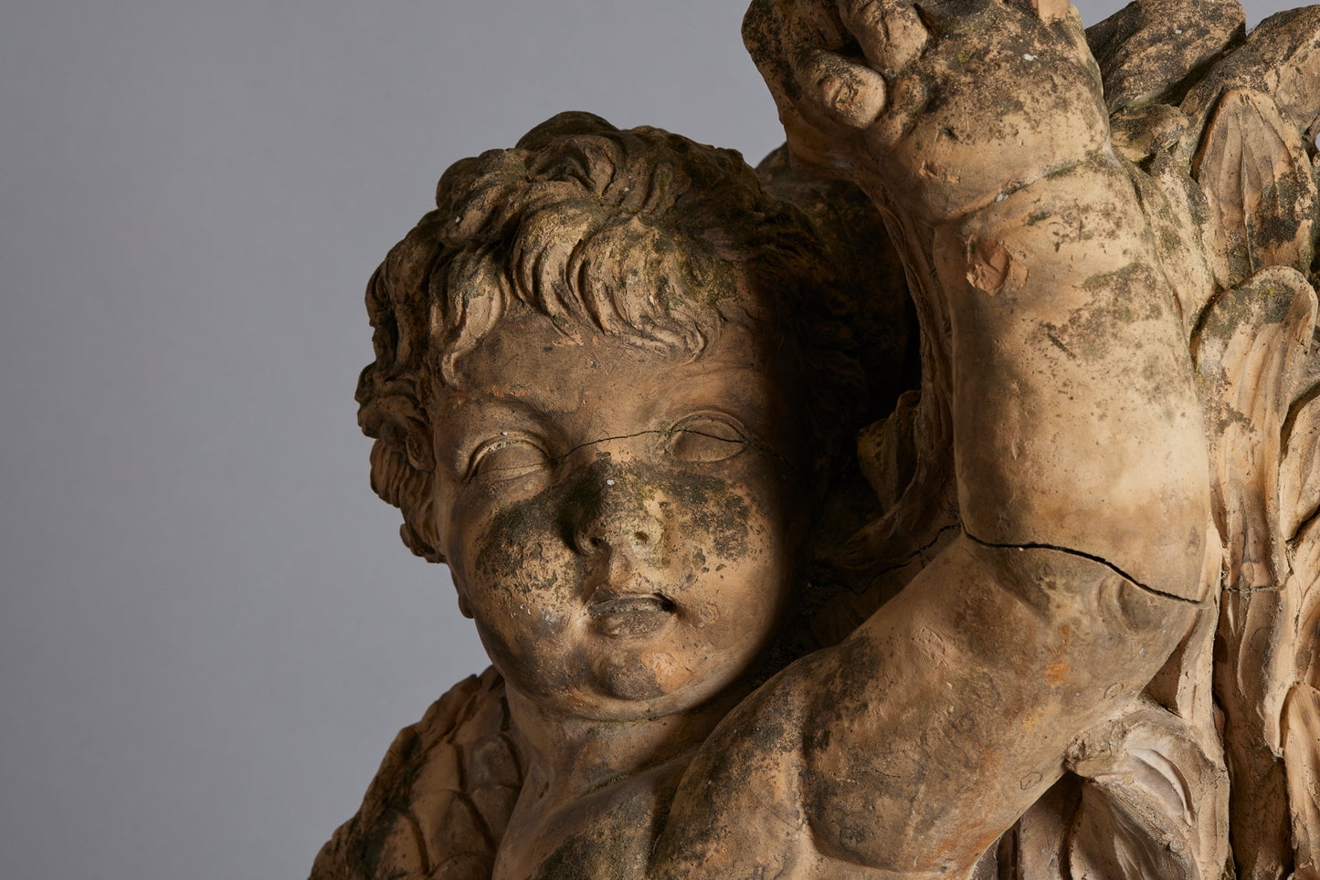 Mid to Late 18th Century Terra Cotta Fountainhead of a Putto Riding a Dolphin