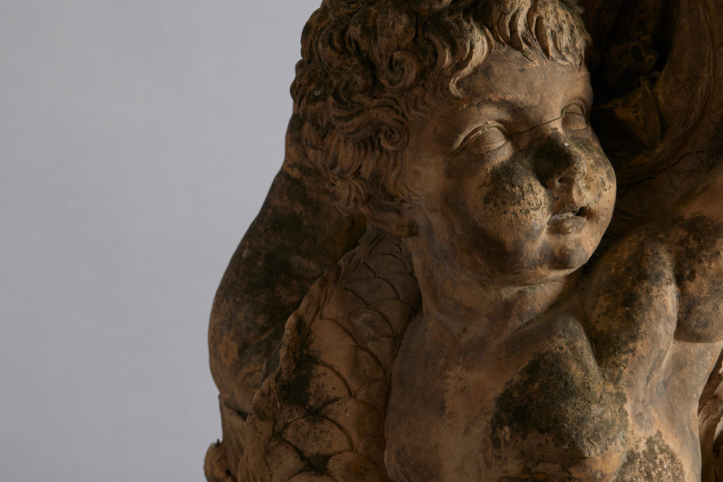 Mid to Late 18th Century Terra Cotta Fountainhead of a Putto Riding a Dolphin