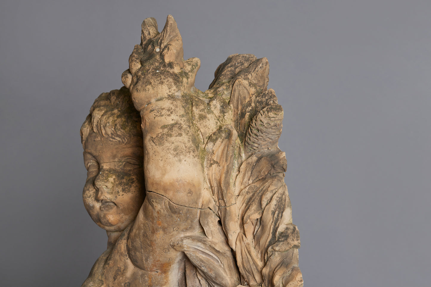 Mid to Late 18th Century Terra Cotta Fountainhead of a Putto Riding a Dolphin