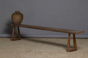 A Wide Top Splayed Leg Early Teak Bench with Beautiful Butterfly Repairs to the Top and a Round Tapered Leg