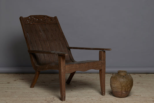 Slat Back and Seated 19th Century Teak Lounge Chair with a Carved Foliate Crest