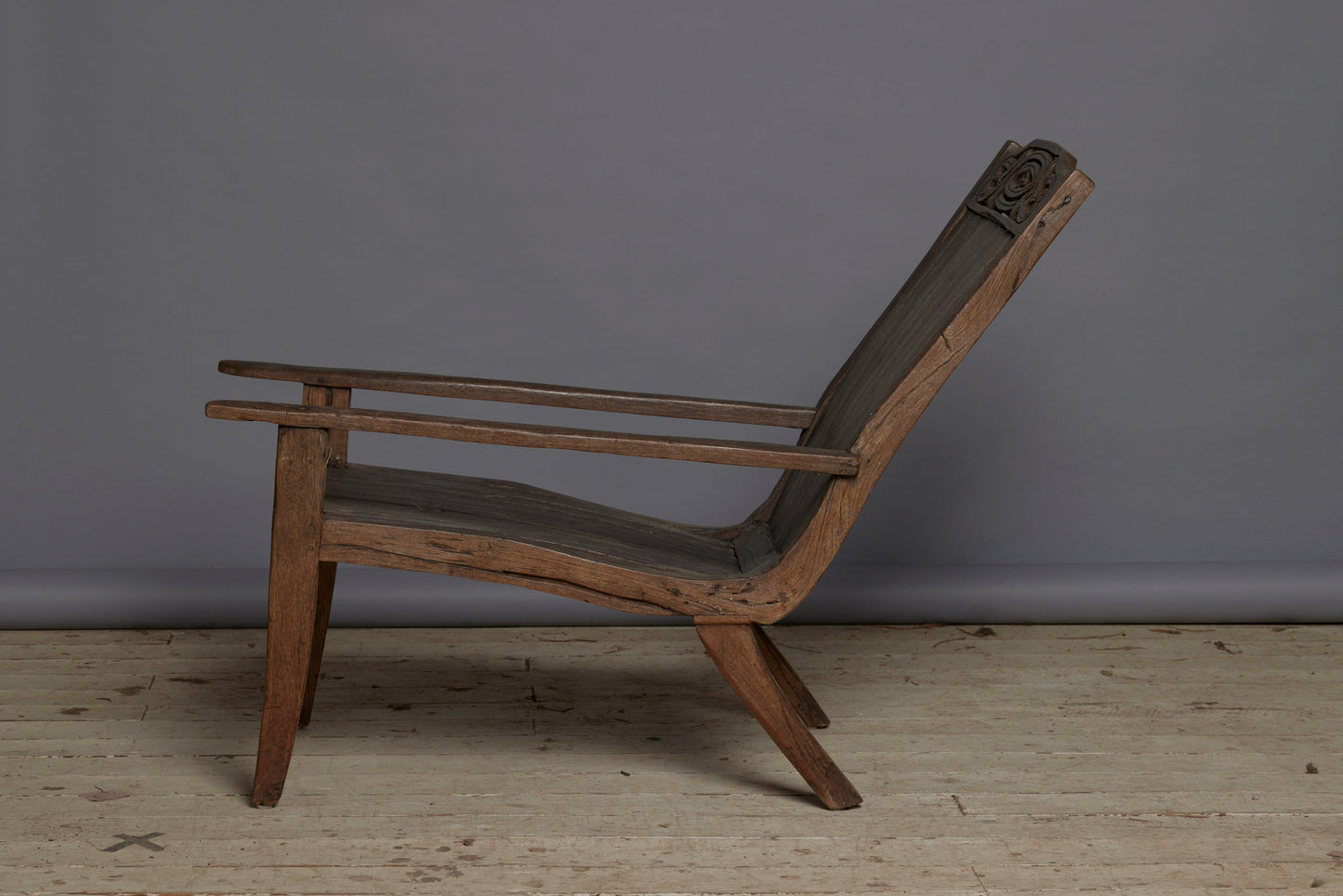 Slat Back and Seated 19th Century Teak Lounge Chair with a Carved Foliate Crest