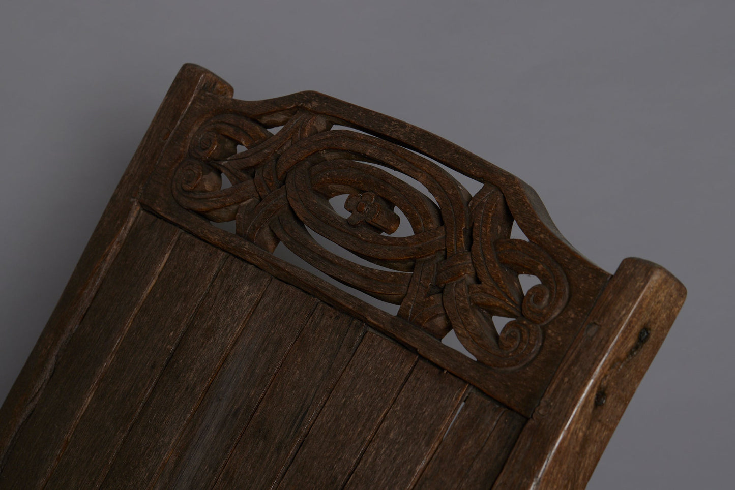 Slat Back and Seated 19th Century Teak Lounge Chair with a Carved Foliate Crest