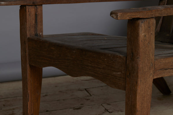 Slat Back and Seated 19th Century Teak Lounge Chair with a Carved Foliate Crest