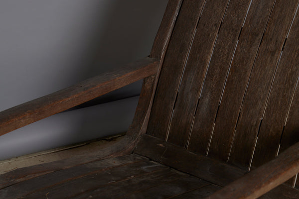 Slat Back and Seated 19th Century Teak Lounge Chair with a Carved Foliate Crest