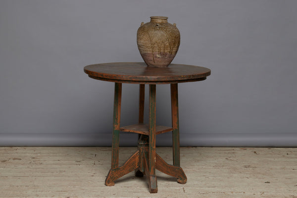 Late 19th Century Arts and Crafts Style Round Top Primitive Teak End Table with a Small Display Shelve Underneath with Traces of Old Green Paint