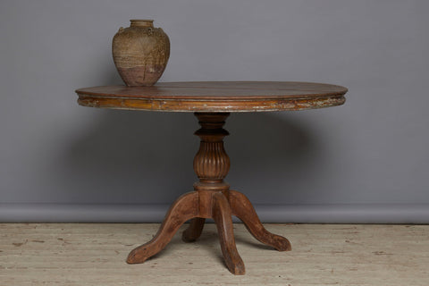 19th Century Two Board Round Top Teak Pedestal Table with a Gadroon Base and Traces of Old Paint