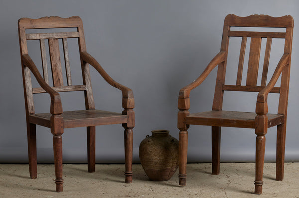 Pair of 19th Century Dutch Colonial Teak Arm Chairs with a Slightly Crested Back