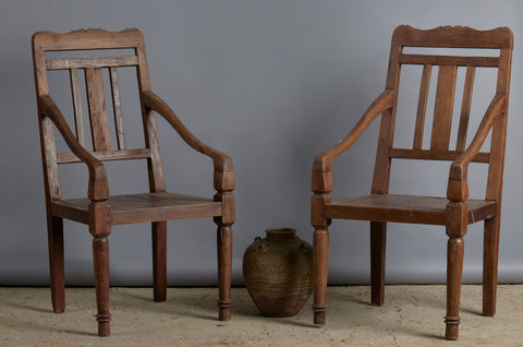 Pair of 19th Century Dutch Colonial Teak Arm Chairs with a Slightly Crested Back