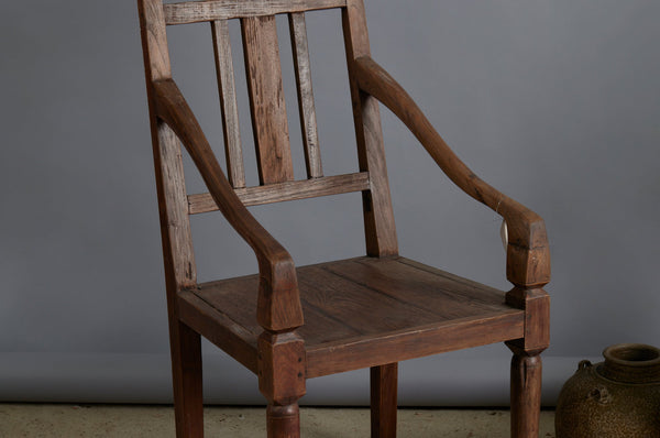 Pair of 19th Century Dutch Colonial Teak Arm Chairs with a Slightly Crested Back
