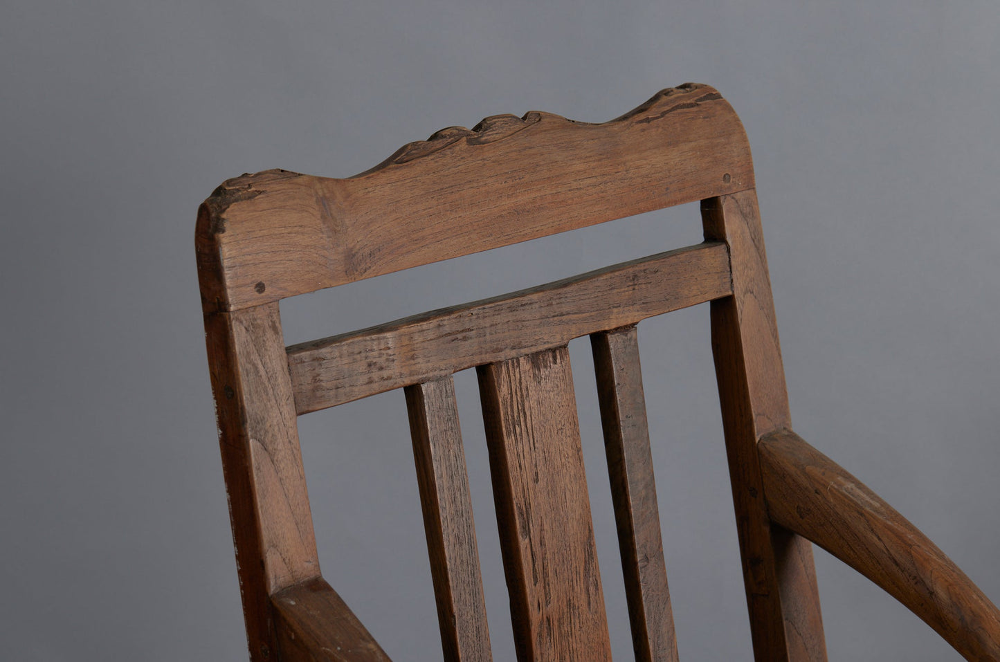 Pair of 19th Century Dutch Colonial Teak Arm Chairs with a Slightly Crested Back
