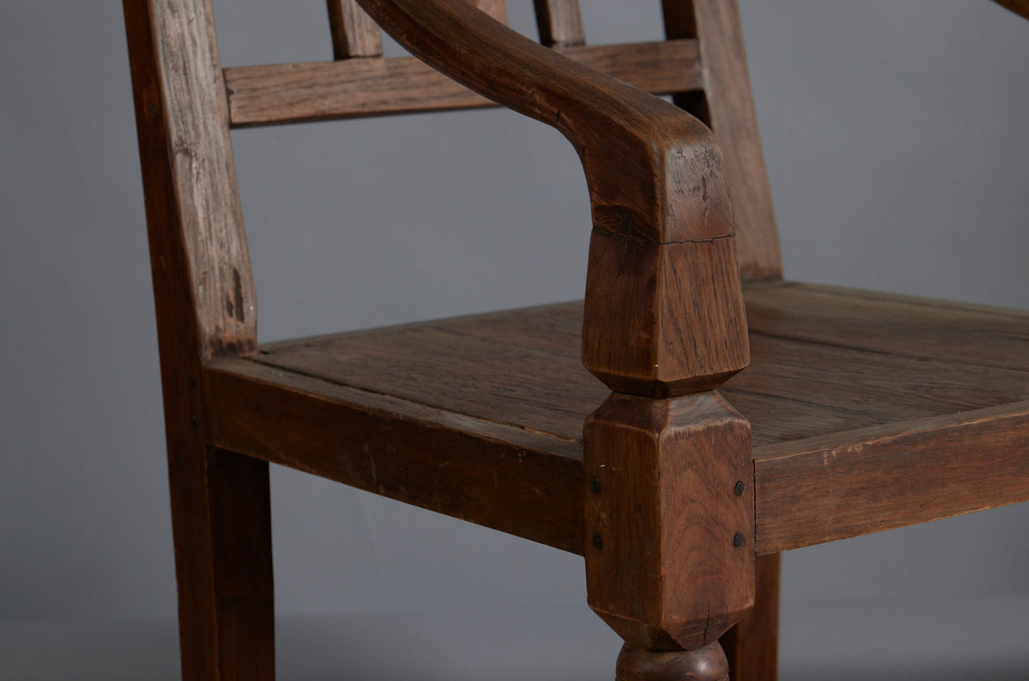 Pair of 19th Century Dutch Colonial Teak Arm Chairs with a Slightly Crested Back