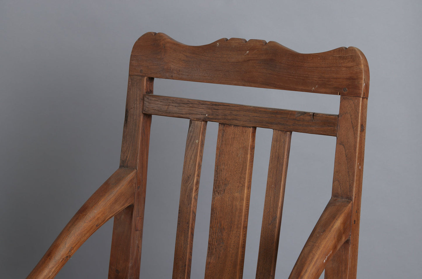 Pair of 19th Century Dutch Colonial Teak Arm Chairs with a Slightly Crested Back
