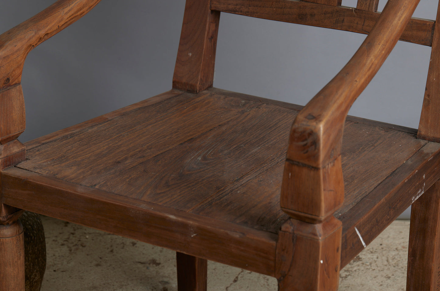 Pair of 19th Century Dutch Colonial Teak Arm Chairs with a Slightly Crested Back