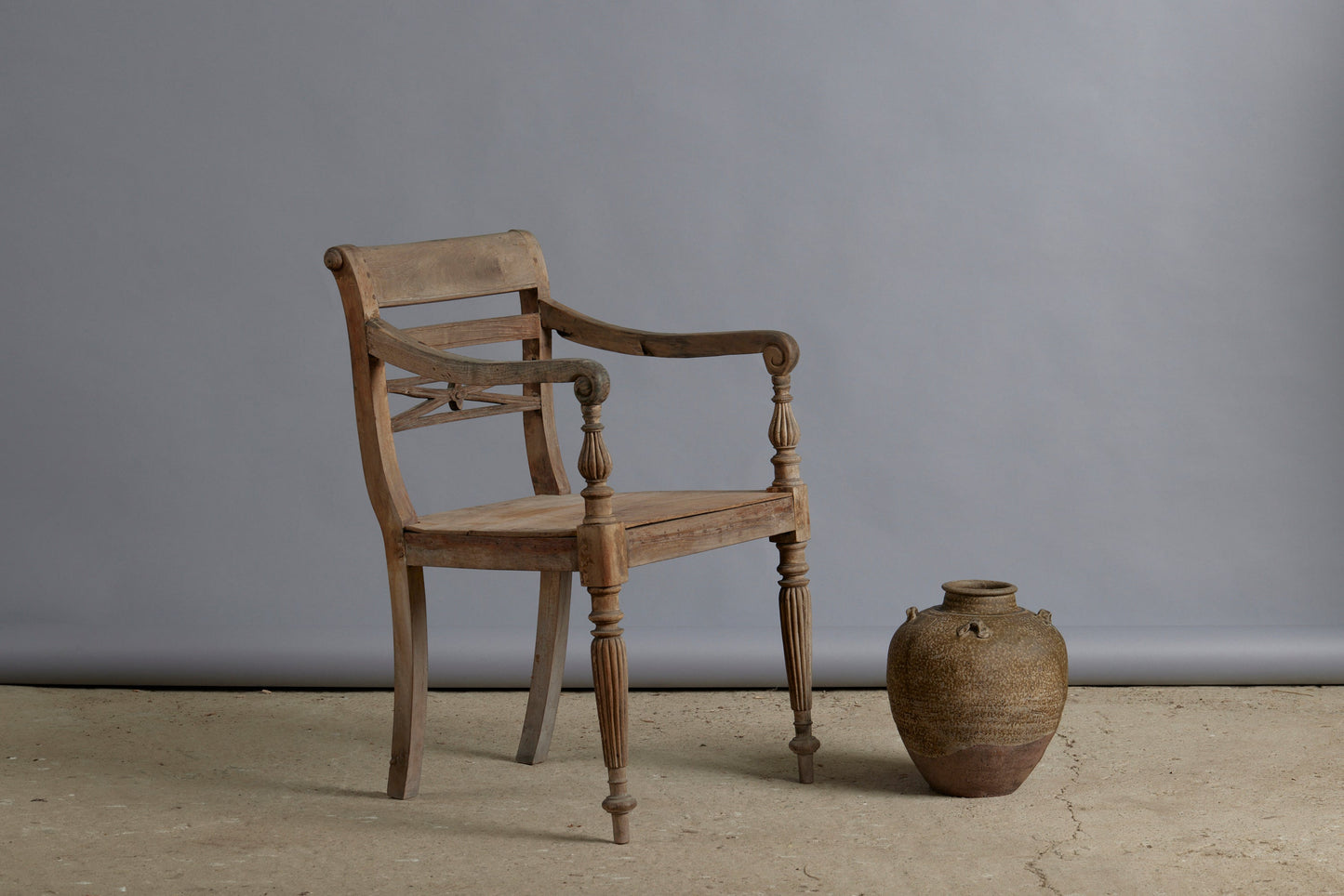 Classic 19th Century Dutch Colonial Teak Raffles Chair with Gadrooned Legs and Carved Back