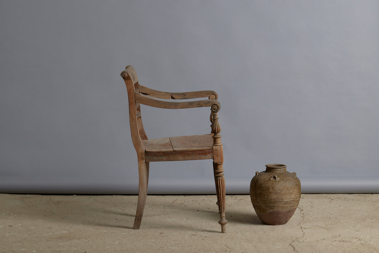 Classic 19th Century Dutch Colonial Teak Raffles Chair with Gadrooned Legs and Carved Back
