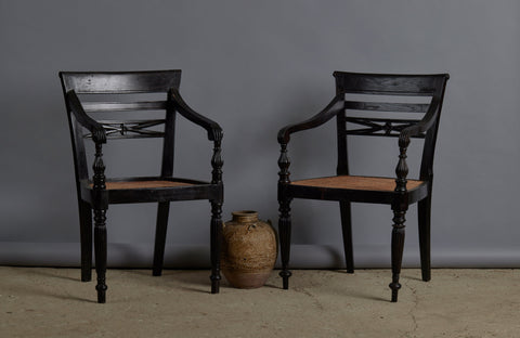 Pair of Ebonized Raffles Chairs with Greeted Arms Gadrooned Legs and Tanned Seats