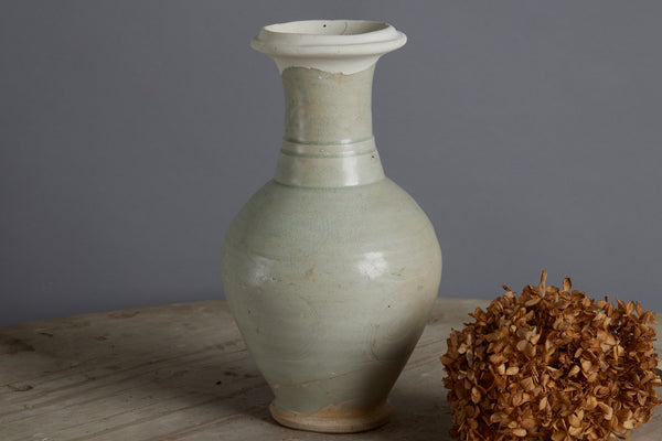 Northern Sung Dynasty Tall Vase with a Slight Celadon Glaze and Repair to the Rim from the Musi River Basin with Traces of a Fine Swirl Decoration