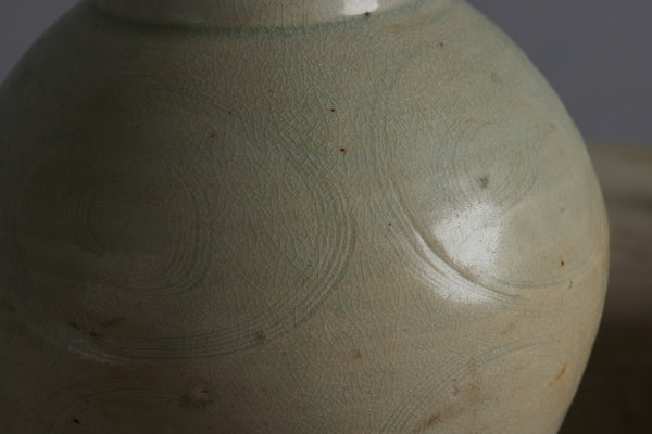 Northern Sung Dynasty Tall Vase with a Slight Celadon Glaze and Repair to the Rim from the Musi River Basin with Traces of a Fine Swirl Decoration
