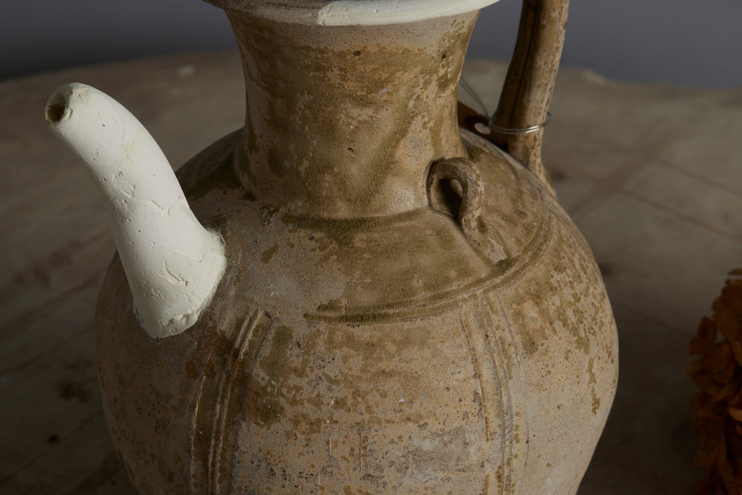A Yue Wei Dynasty Teapot with Spatterware Decoration and Repairs to the Spout and Upper Lip