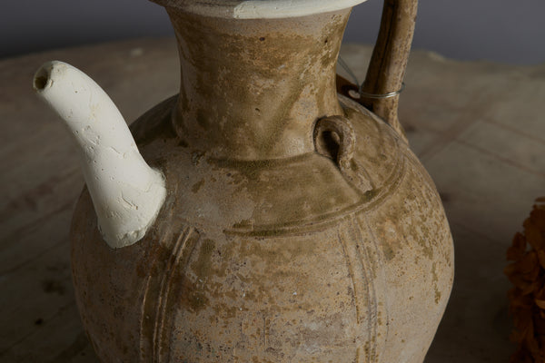 A Yue Wei Dynasty Teapot with Spatterware Decoration and Repairs to the Spout and Upper Lip
