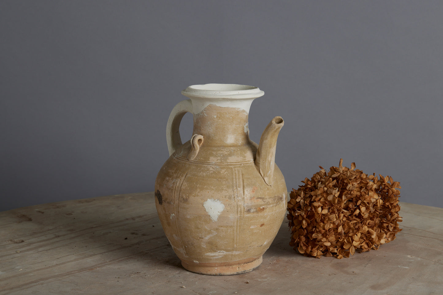 A Yue Wei Dynasty Teapot from the Musi River Basin in Sumatra with Repairs to the Handle and Upper Rim