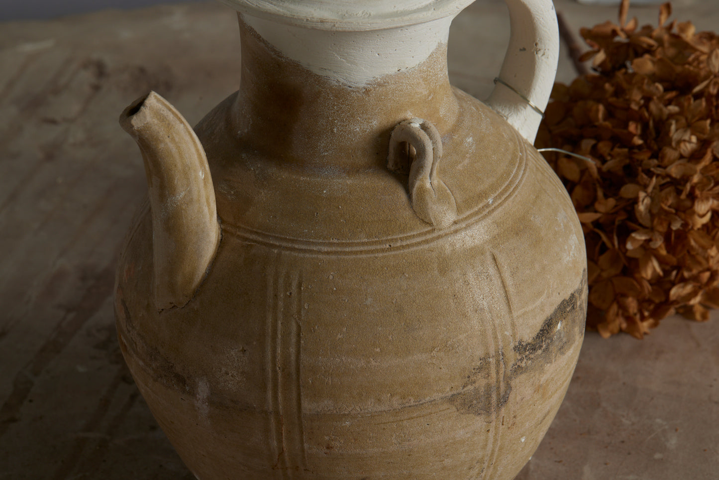 A Yue Wei Dynasty Teapot from the Musi River Basin in Sumatra with Repairs to the Handle and Upper Rim