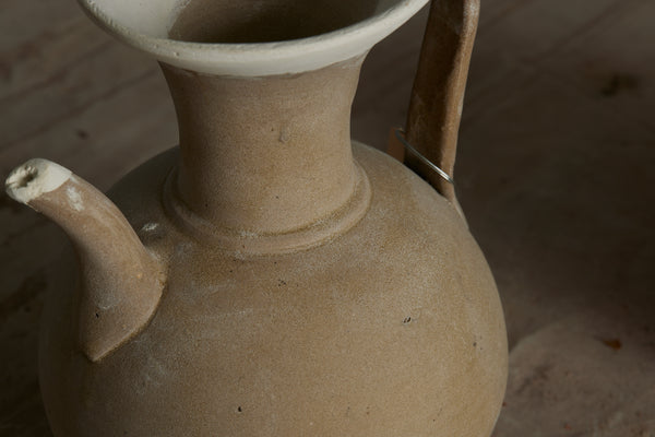 Beige Color Glazed Sung Dynasty Teapot with a Reeded Strap Handle and Repairs to the Upper Lip and Spout