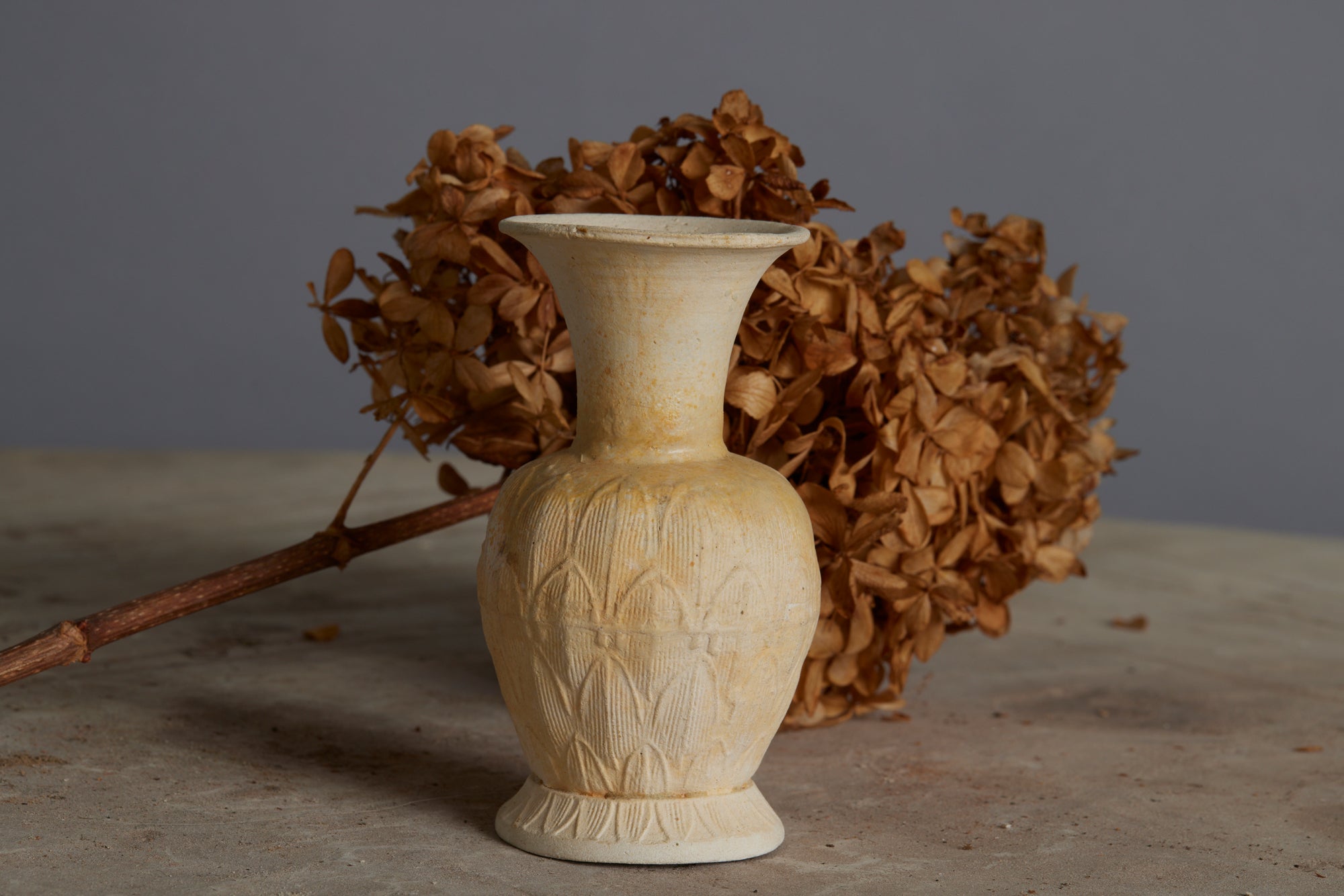 A Small White Sung Dynasty Lotus Decorated Altar Vase