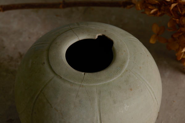 Small Sung Dynasty Pale Celadon Glazed Lotus Bud Vase Discovered in the Musi River Basin in Sumatra with a Small Chip in the Rim