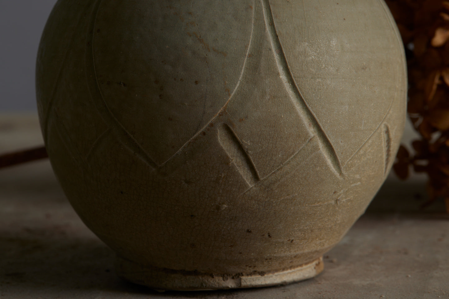 Small Sung Dynasty Pale Celadon Glazed Lotus Bud Vase Discovered in the Musi River Basin in Sumatra with a Small Chip in the Rim