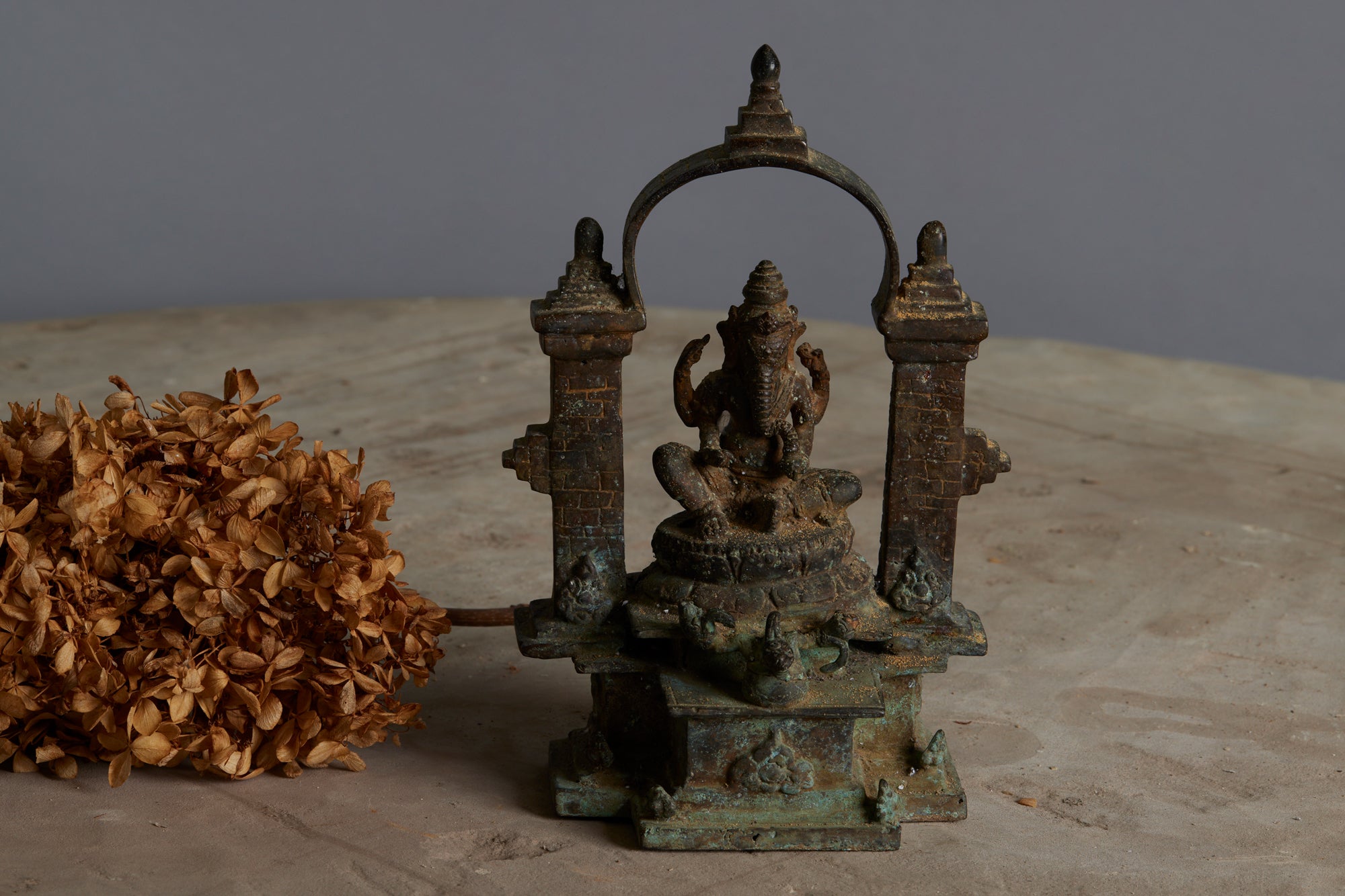 Early Bronze Altar Figure of a Seated Ganesh Underneath a Bridged Arch from Java