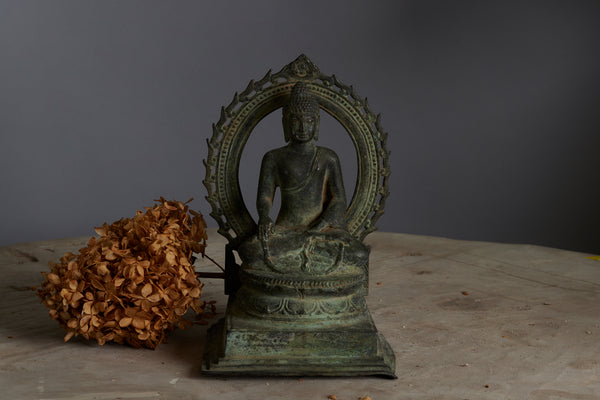 Early 15th-16th Century Bronze Buddha within a Large Halo from the Island of Java