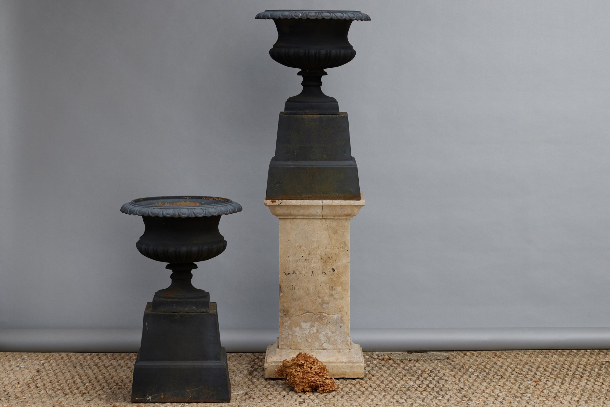 Pair of Cast Iron Urns on Stands